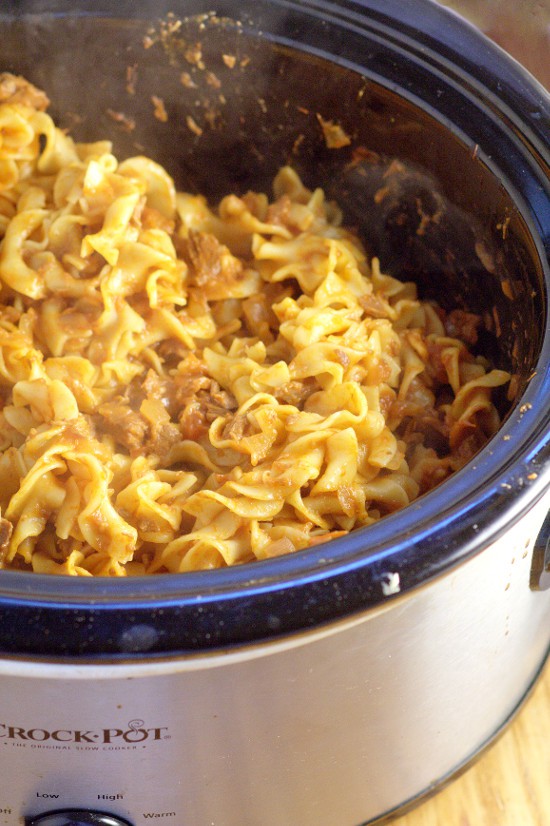Crockpot Beef and Noodles with Tomatoes recipe is a dinner time classic with juicy stew beef, zesty tomatoes, and comforting egg noodles, all in the slow cooker.  Perfect for a simple and easy family dinner recipe!