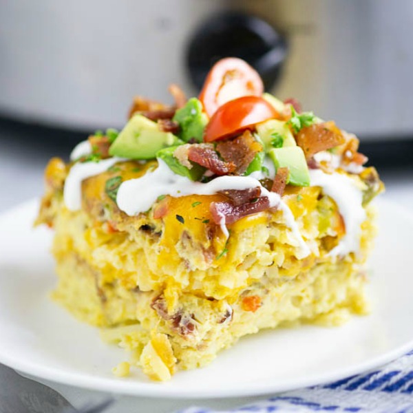 Overnight Crockpot Breakfast Casserole is a classic breakfast casserole with eggs, sausage, bacon, hash browns, and cheese. It's easy to make, great for the holidays and feeding a crowd.