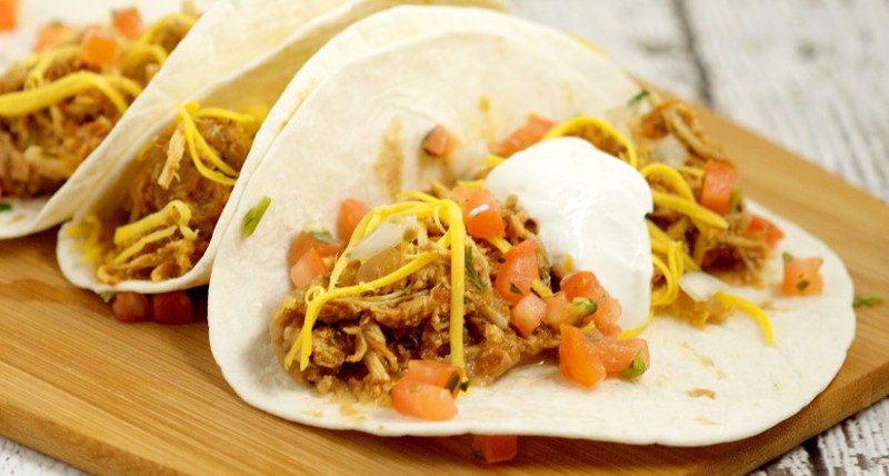 Easy but flavorful Crockpot Chicken Tacos recipe is a true fix-it-and-forget meal, with just 5 ingredients.  Top these zesty chicken tacos with cheese, sour cream, and pico de gallo for a full family slow cooker meal!  Love this! So easy!