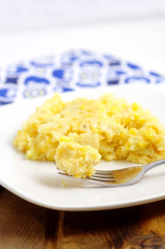 Crockpot Corn Pudding recipe with sweet corn and cornbread mixed with salty, gooey cheese, all in the slow cooker, for a delicious and simple side dish.  I love this at Thanksgiving every year! Plus it takes care of the veggies and the bread!