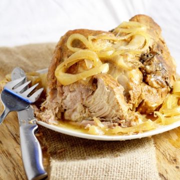 Tender, juicy Crockpot Pork Roast recipe with added zing from soy sauce and red wine vinegar is a perfect low maintenance easy dinner idea for family and company.  Pair it with your classic mashed potatoes and veggies for a cozy meal.