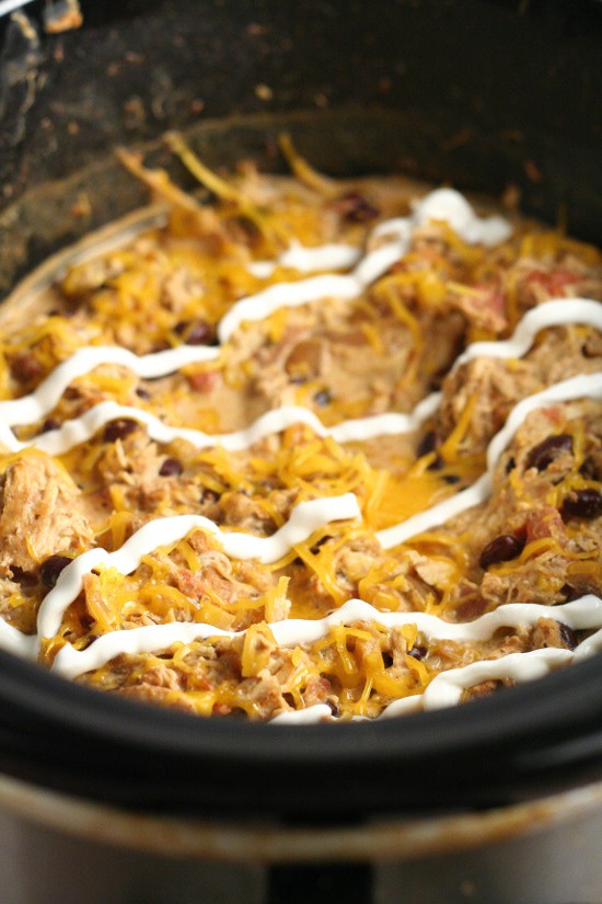 Crockpot Southwest Chicken Chili recipe is so easy you don't have to thaw the chicken! With cream cheese and classic Southwest flavors like corn and beans. Serve with warm, buttered cornbread. Such an easy family dinner recipe idea in the slow cooker!  