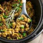 Free up your oven with this simple and classic Crockpot Stuffing! A traditional recipe with onions, celery, and herbs, cooked to perfection in the slow cooker!