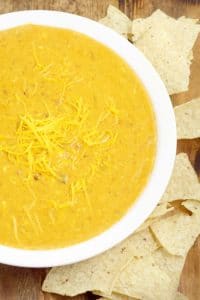 Creamy, gooey, cheesy Easy Slow Cooker Chili con Queso Dip recipe has just 4 ingredients and will be the star of the show at your next party! Amazing dip and appetizer recipe! This stuff goes fast!