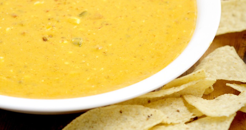 Creamy, gooey, cheesy Easy Slow Cooker Chili con Queso Dip recipe has just 4 ingredients and will be the star of the show at your next party! Amazing dip and appetizer recipe! This stuff goes fast!