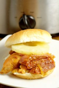 Hawaiian Crockpot Ham Sandwiches recipe with slow cooked salty ham along with sweet pineapple and brown sugar, and tangy Dijon mustard, all on one delicious bun. Great crockpot recipe for family dinner.  This would be a great way to use up leftover ham too!