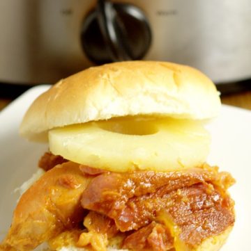 Hawaiian Crockpot Ham Sandwiches recipe with slow cooked salty ham along with sweet pineapple and brown sugar, and tangy Dijon mustard, all on one delicious bun. Great crockpot recipe for family dinner.  This would be a great way to use up leftover ham too!