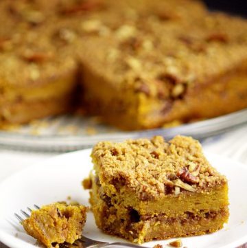 Rich and moist Pumpkin Cinnamon Coffee Cake recipe made with pumpkin pie yogurt, pumpkin, and a crunchy cinnamon-pecan streusel for an amazing Fall breakfast recipe. Also freezer friendly! OMG. Pumpkin spice for breakfast?!