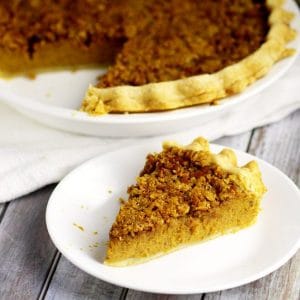 Creamy eggnog and spiced pumpkin come together in this heavenly Eggnog Pumpkin Pie recipe, topped with a crunchy, sweet brown sugar and pecan topping! Omg. Two of my favorites in one delicious pie recipe! Must try ASAP!