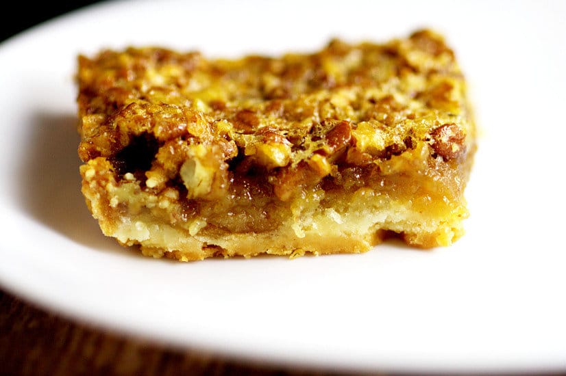 Southern Pecan Pie Bars recipe with a soft crust and classic pecan pie filling come together to make one sweet, gooey, heavenly dessert recipe that will be the highlight of your feast!  Pecan Pie Bars would be an amazing dessert recipe for Thanksgiving and Christmas too!