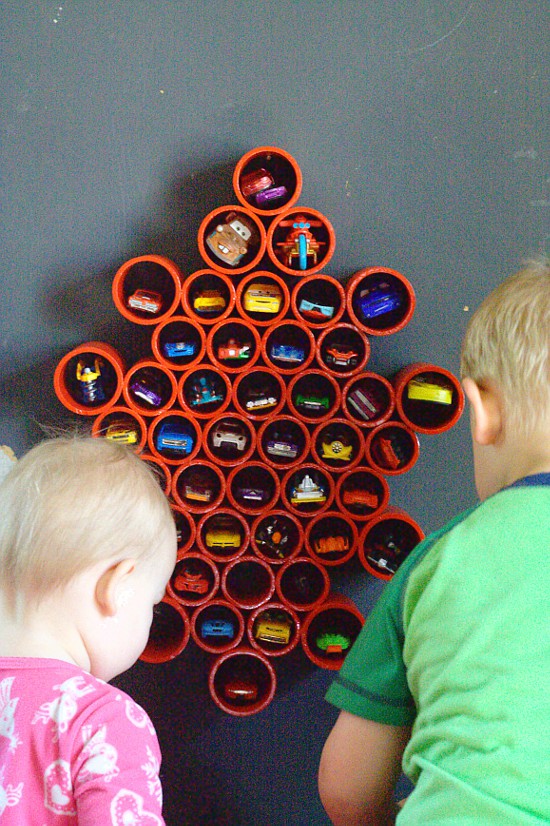 DIY Toy storage idea and DIY Toy Organization idea for the playroom. Organize all of your boys' Matchbox with this DIY Matchbox Car Storage for the wall.  It's super easy and the kids will love it! (and you'll love it too,  when there is no longer a Matchbox car explosion all over your playroom.