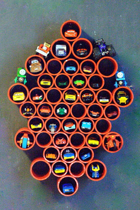 DIY Toy storage idea and DIY Toy Organization idea for the playroom. Organize all of your boys' Matchbox with this DIY Matchbox Car Storage for the wall.  It's super easy and the kids will love it! (and you'll love it too,  when there is no longer a Matchbox car explosion all over your playroom.