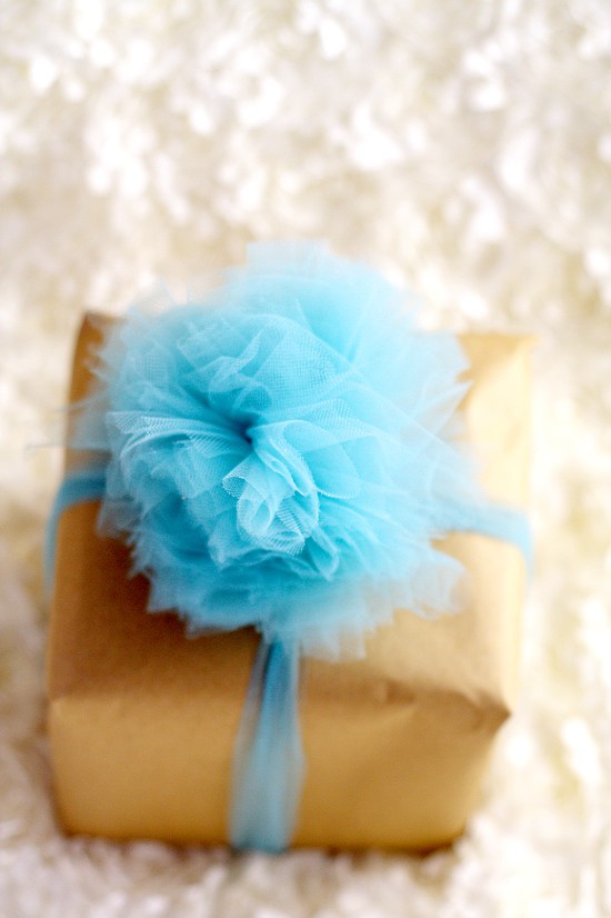 Learn how to make a beautiful and totally easy DIY Tulle Gift Bow with this easy Diy crafts tutorial to add a pretty finishing touch to all of your gifts. Perfect for Christmas gifts, birthday gifts, baby shower gifts, wedding shower gifts, and MORE! This is so pretty! Can't wait to try it!