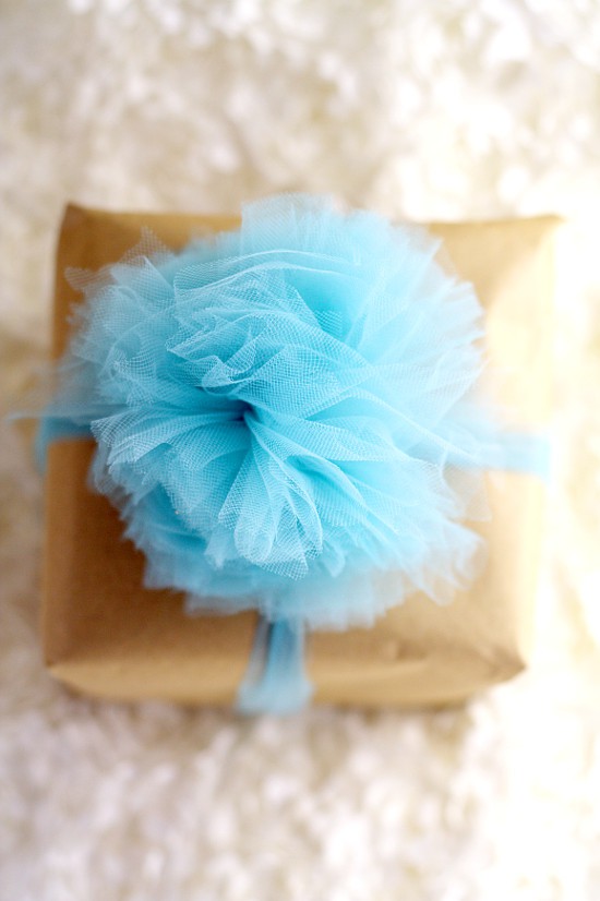 Learn how to make a beautiful and totally easy DIY Tulle Gift Bow with this easy Diy crafts tutorial to add a pretty finishing touch to all of your gifts. Perfect for Christmas gifts, birthday gifts, baby shower gifts, wedding shower gifts, and MORE! This is so pretty! Can't wait to try it!