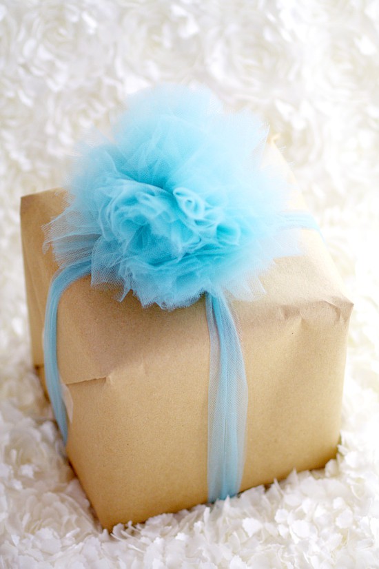 Learn how to make a beautiful and totally easy DIY Tulle Gift Bow with this easy Diy crafts tutorial to add a pretty finishing touch to all of your gifts. Perfect for Christmas gifts, birthday gifts, baby shower gifts, wedding shower gifts, and MORE! This is so pretty! Can't wait to try it!