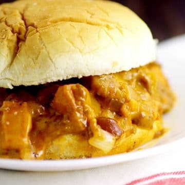 Easy Family Dinner Recipe - Slow Cooker Chili Cheese Dog Sloppy Joes.  Classic chili cheese dogs and sloppy joes join forces in these Slow Cooker Chili Cheese Dog Sloppy Joes to make a gooey, cheesy, cozy, comfort food meal in the Crockpot.  OMG. This looks amazing!