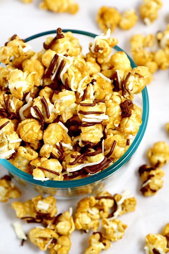 Make your own Homemade Zebra Caramel Popcorn recipe for an easy and sweet snack, treat, or gift idea with warm, sweet oven baked caramel corn, drizzled in milk chocolate and white chocolate for a to-die-for treat.