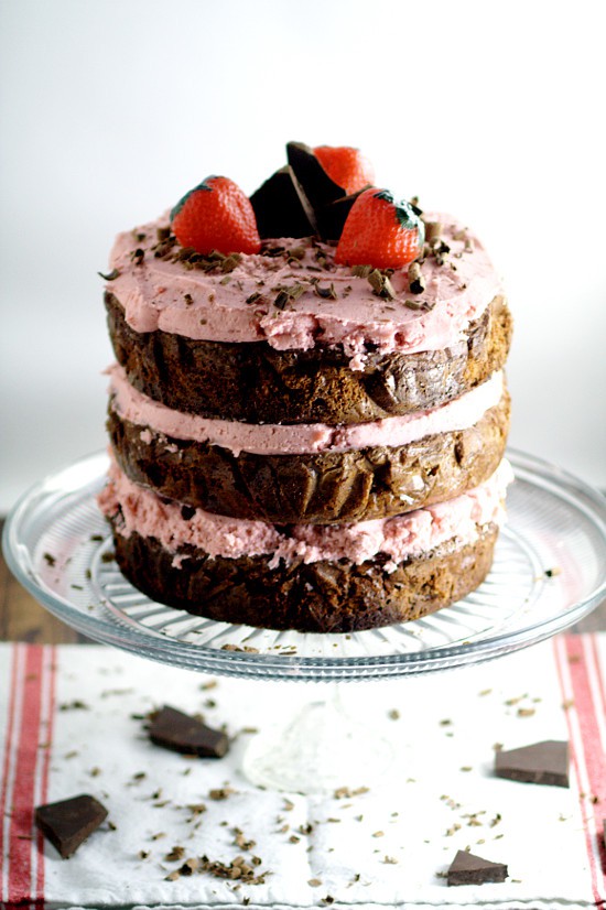 Decadent Dark Chocolate Cake recipe with Strawberry Buttercream is an indulgent chocolate treat.  Sweet strawberry buttercream, sandwiched between layers or rich dark chocolate cake.   Mmmmm... Chocolate and strawberries would be a yummy treat for Valentine's Day too!