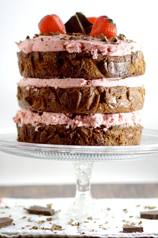  Decadent Dark Chocolate Cake recipe with Strawberry Buttercream is an indulgent chocolate treat.  Sweet strawberry buttercream, sandwiched between layers or rich dark chocolate cake.   Mmmmm... Chocolate and strawberries would be a yummy treat for Valentine's Day too!