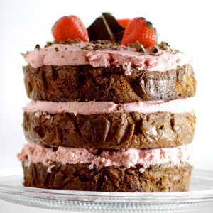 Decadent Dark Chocolate Cake recipe with Strawberry Buttercream is an indulgent chocolate treat.  Sweet strawberry buttercream, sandwiched between layers or rich dark chocolate cake.   Mmmmm... Chocolate and strawberries would be a yummy treat for Valentine's Day too!