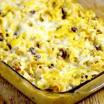 Enchilada Pasta Bake recipe is a delicious way to use up leftover taco meat and great for family dinner.  Noodles tossed with a creamy, cheesy, and slightly spicy sauce mixed with taco-seasoned ground beef, corn, and black beans. Perfect easy pasta recipe for family night!