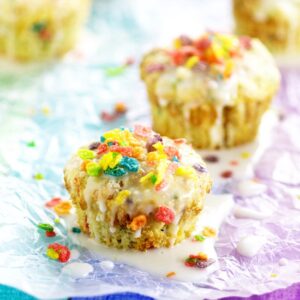 Rainbow Fruity Pebbles Muffins are a pretty fun breakfast idea perfect for St Patrick's Day. Fun and easy to make these Rainbow Fruity Pebbles Muffins with a crunchy streusel topping and sweet, simple glaze will make you feel like you've hit the breakfast jackpot!