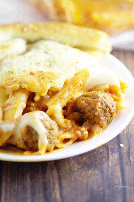 Meat Lover Pizza Pasta Bake is a yummy easy pasta bake recipe for family dinner loaded up with all your meaty favorites like sausage, ham, bacon, pepperoni, and meatballs with penne noodles in classic red sauce. So yummy!