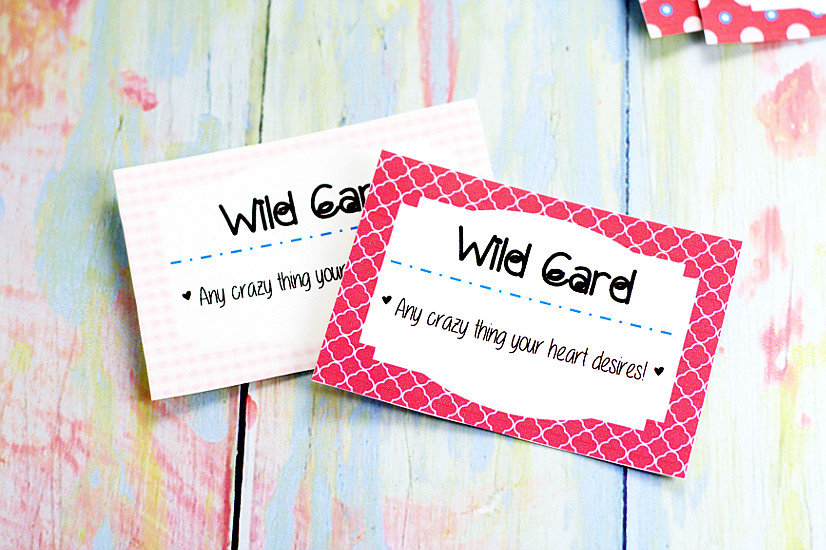 Wild card from love coupon set on pastel rainbow wood background