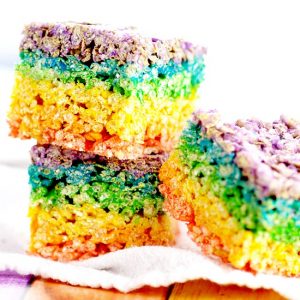 Rainbow Rice Krispie Treats recipe. Easy, no bake Rainbow Rice Krispie Treats make a pretty and festive treat for St Patrick's Day, or even just for fun, that everyone will love! What an adorable dessert recipe for St Patrick's Day or even a rainbow birthday party!