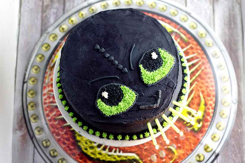 Easy Toothless Birthday Cake tutorial. Make your little Dragon-Trainer-in-Training happy with this simple but awesome fire-breathing DIY Toothless Cake.  Do it yourself with a full tutorial and supply list!