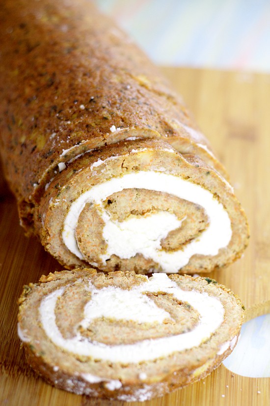 Carrot Cake Roll with cream cheese frosting filling.  Moist, spiced carrot cake rolled up with creamy cream cheese frosting makes this Carrot Cake Roll exceptional for a yummy Spring dessert. Oh, this would be perfect for Easter this year!