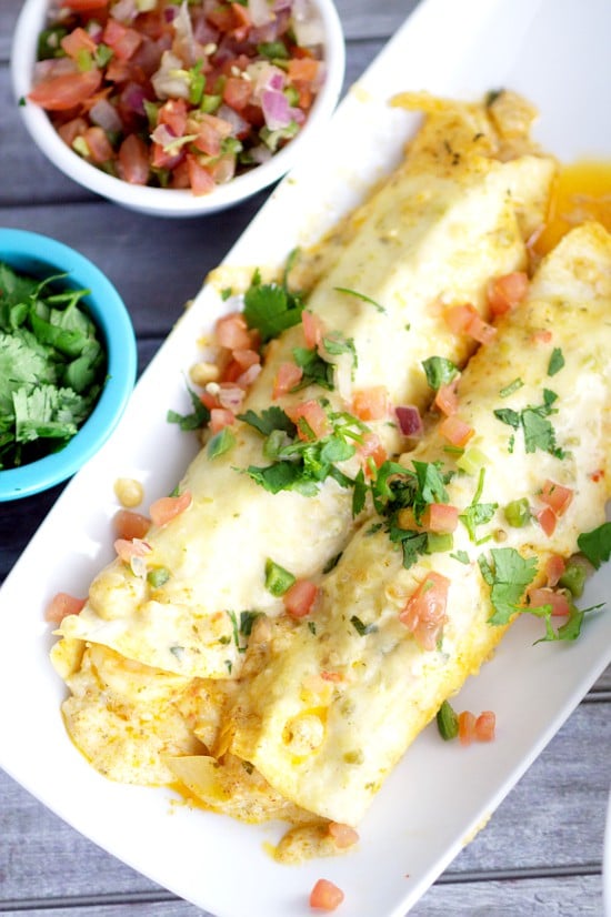 Creamy Shrimp Enchiladas - Creamy and rich with added pops of flavor from onions and peppers, these Creamy Shrimp Enchiladas are easy enough for family dinner and elegant enough for a date night in. These look fabulous!