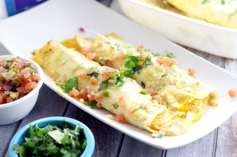 Creamy Shrimp Enchiladas - Creamy and rich with added pops of flavor from onions and peppers, these Creamy Shrimp Enchiladas are easy enough for family dinner and elegant enough for a date night in. These look fabulous!
