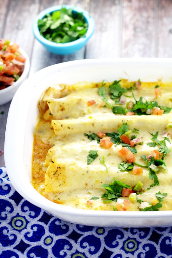 Creamy Shrimp Enchiladas - Creamy and rich with added pops of flavor from onions and peppers, these Creamy Shrimp Enchiladas are easy enough for family dinner and elegant enough for a date night in. These look fabulous!