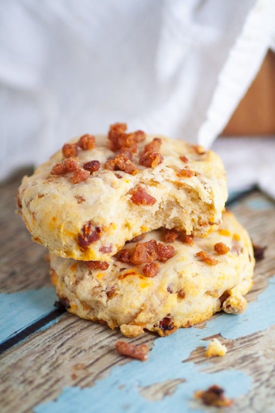 Bacon and Sun Dried Tomato Biscuits make a delicious and easy side dish recipe.  Even better than a traditional biscuits, these Bacon and Sun Dried Tomato Biscuits are flaky and golden with pops of zesty flavor from sun-dried tomatoes and bacon.