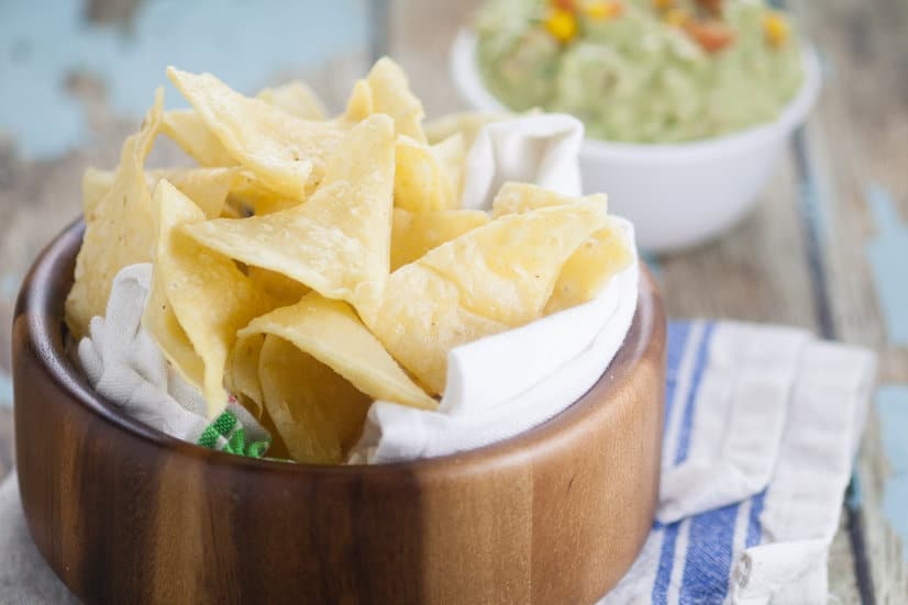 Homemade Corn Tortilla Chips are easy to make! A simple recipe to make your own Homemade Corn Tortilla Chips that are absolutely delicious.  Store bought tortilla chips just can't compete with these crunchy fresh ones!
