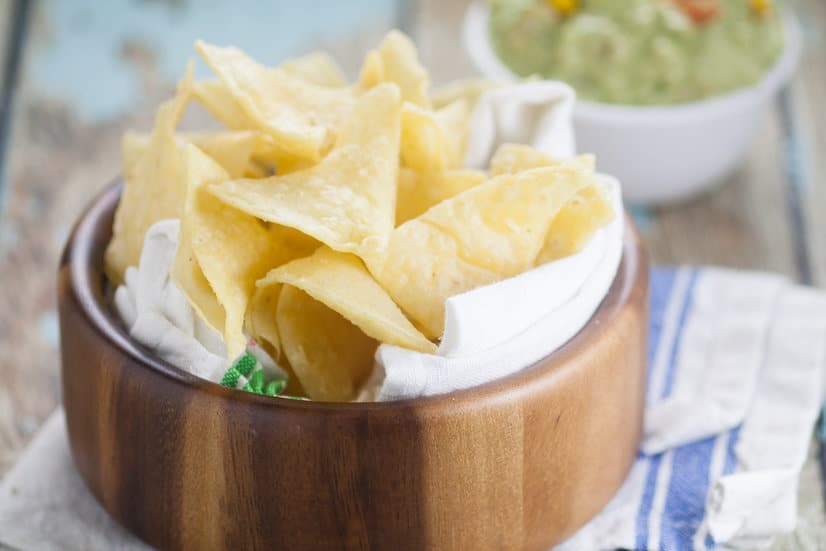 Homemade Corn Tortilla Chips are easy to make! A simple recipe to make your own Homemade Corn Tortilla Chips that are absolutely delicious.  Store bought tortilla chips just can't compete with these crunchy fresh ones!