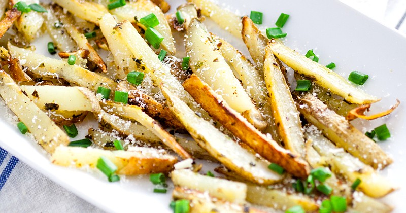 Garlic Chive Baked French Fries recipe - This Garlic Chive Baked French Fries recipe turns an American classic into a zesty new favorite with fresh garlic and chives tossed with butter and fries and baked in the oven. This looks like a fabulous quick and easy side dish recipe!  What's not to love?! 11 Cheap Meals with Potatoes - You can save money by making some frugal meals to stretch your food and your money with these 11 yummy and filling Cheap Meals to Make with Potatoes. Frugal living and saving money with these frugal meals with potatoes. They're sooo good too!