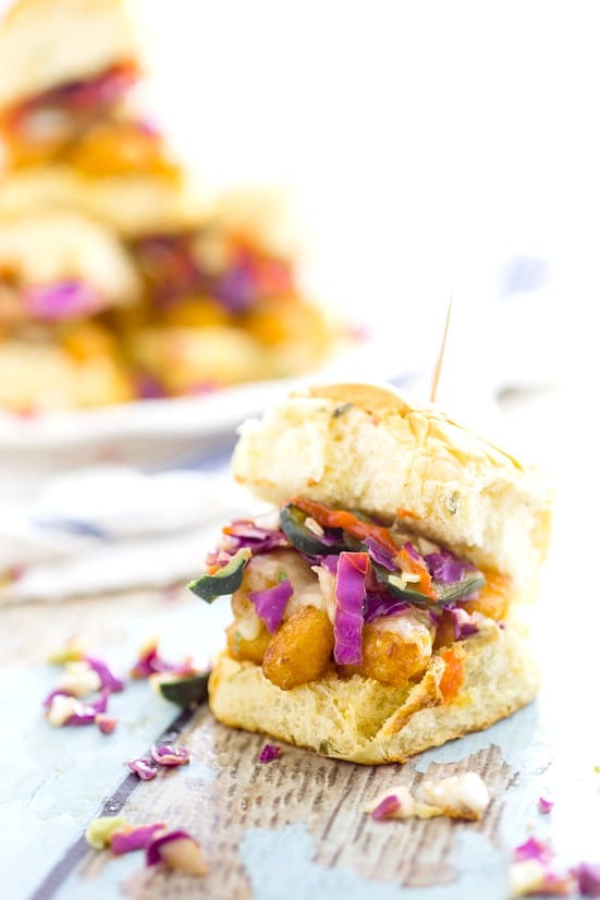 Sriracha Ranch Popcorn Shrimp Sliders recipe - a quick and easy dinner recipe and a classic-gone-coastal, these zesty Sriracha Ranch Popcorn Shrimp Sliders topped with cheese and a cool, crisp fresh slaw are a perfect quick and easy Summer dinner recipe. 