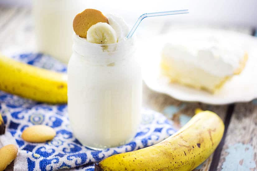 Banana Cream Pie Milkshake Recipe - Two cool, creamy Summer favorites combine into one quick and easy no bake dessert recipe in this simple, scrumptious Banana Cream Pie Milkshake recipe! Top with whipped cream and vanilla wafer cookies for a special comfort food touch!