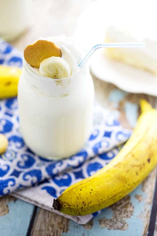 Banana Cream Pie Milkshake Recipe - Two cool, creamy Summer favorites combine into one quick and easy no bake dessert recipe in this simple, scrumptious Banana Cream Pie Milkshake recipe! Top with whipped cream and vanilla wafer cookies for a special comfort food touch!