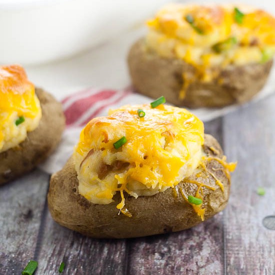 Twice Baked Deviled Potatoes recipe - Named after their eggy-likeness, these Twice Baked Deviled Potatoes are tangy baked potatoes, whipped, and oven-baked to golden perfection. Yummy and easy potato side dish recipe!