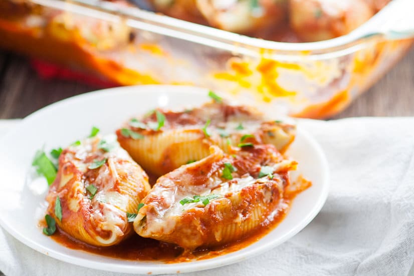 5 Cheese Stuffed Shells Recipe is an easy pasta recipe perfect for family dinner. Classic Italian flavors featuring five different cheeses, garlic, spinach, and red sauce this 5 Cheese Stuffed Shell Recipe is creamy, cheesy, and satisfying. Perfect for a meatless family dinner recipe! Yum! I love cheese! 