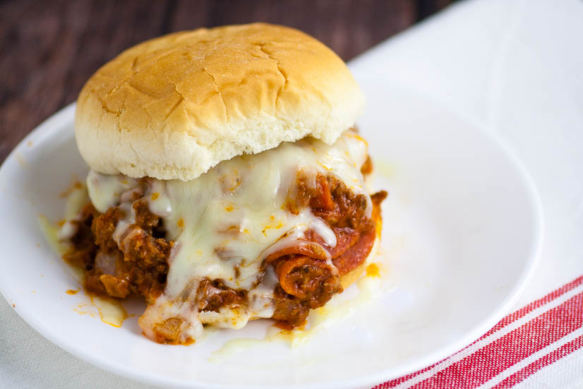 Pizza Sloppy Joes Recipe - Quick and easy Pizza Sloppy Joes recipe is saucy and cheesy with everything you love about pizza and can be made in just 30 minutes for a simple quick and easy family dinner recipe!  Look at that cheese! Yum!