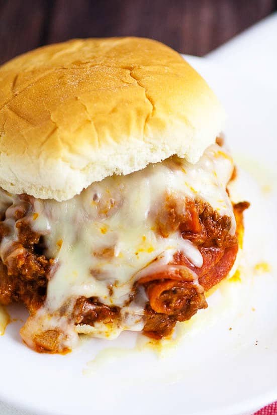 Pizza Sloppy Joes Recipe - Quick and easy Pizza Sloppy Joes recipe is saucy and cheesy with everything you love about pizza and can be made in just 30 minutes for a simple quick and easy family dinner recipe!  Look at that cheese! Yum!