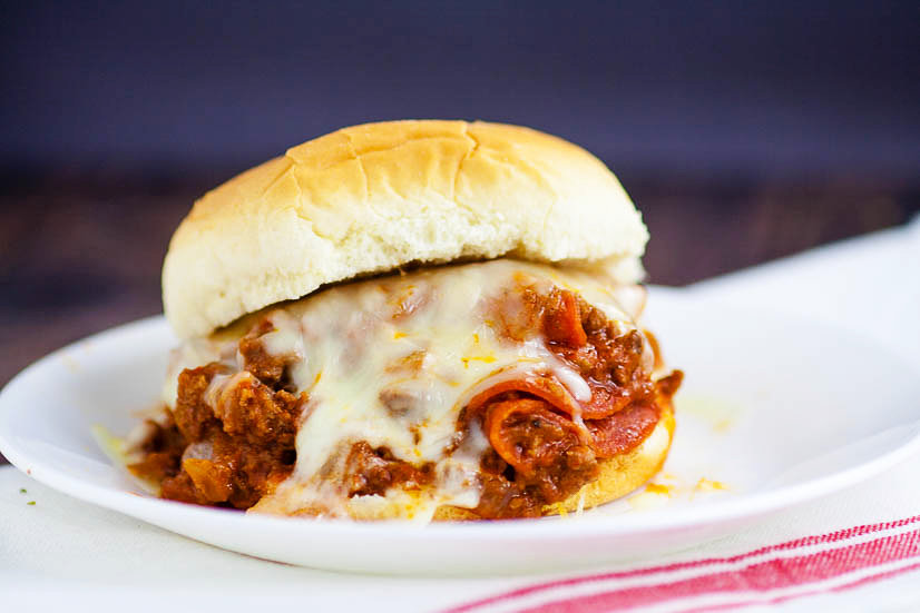 Pizza Sloppy Joes Recipe - Quick and easy Pizza Sloppy Joes recipe is saucy and cheesy with everything you love about pizza and can be made in just 30 minutes for a simple quick and easy family dinner recipe!  Look at that cheese! Yum!