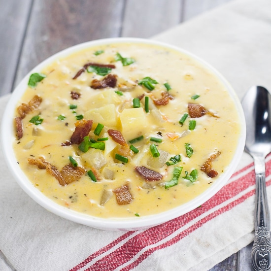 Cheesy Potato Soup Recipe - Warm and creamy Cheesy Potato Soup recipe is a deliciously perfect classic comfort food recipe to keep you warm and happy all winter long. Yummmm! One of my all time favorite delicious soup recipes. Ever. 
