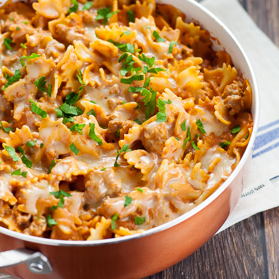 Creamy Sausage Pasta recipe - This Creamy Sausage Pasta recipe is simple, cheesy, and perfect for an easy family dinner recipe with a creamy red sauce, Italian sausage, and melted gooey cheese. Super easy pasta for family dinner recipe and can be made in just 30 minutes! 