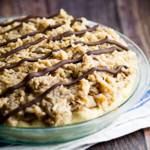 German Chocolate Pie recipe - Silky and creamy, this sweet German Chocolate Pie recipe combines a chocolate cream pie with German sweet chocolate, topped with caramel coconut pecan frosting to make a pie that's to-die-for. Such an easy pie recipe!