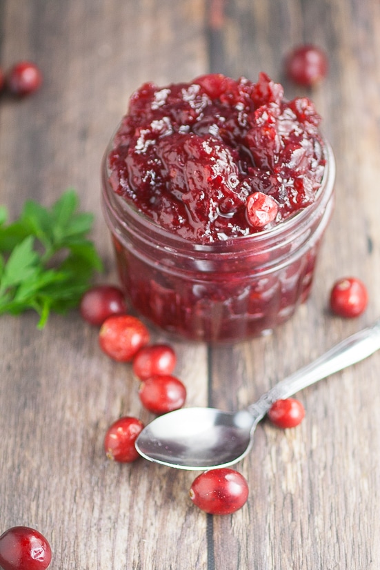 Easy Homemade Cranberry Sauce recipe with apple juice and a hint of maple - A simple, sweet and tangy version of a classic, this 4 ingredient Easy Homemade Cranberry Sauce recipe promises to be a pretty and delicious addition to your Thanksgiving feast!